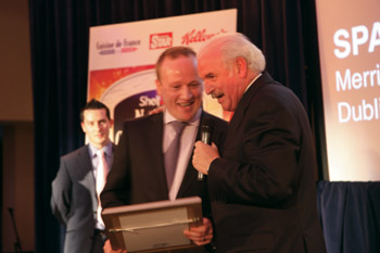 Thomas Ennis, Spar Merrion Row, Dublin on stage with Marty to receive his award