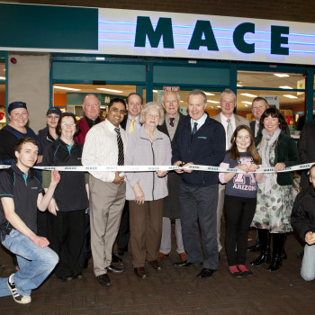 Pat and Áine Flanagan with their team celebrating the most recent revamp on the Dublin Road store in Dundalk