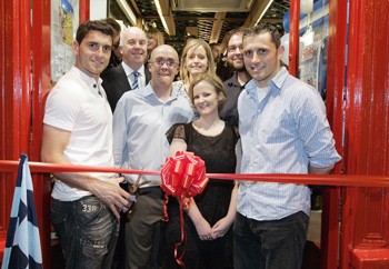 Triumphant Dublin GAA footballers and brothers Bernard (left) and Alan (right) Brogan cut the ribbon with (from left): Shay and son Garret Connolly (owner) and members of staff including Catherine Noakes and Alison Mooney at the official launch of Baggot Street Wines.