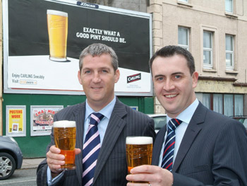 From left: On-Trade Key Account Manager Leo Brennan and Ger Corkery, Field Sales Manager for Molson Coors Ireland celebrate the new Carling Advertising Campaign in Cork City.