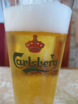 Carlsberg has warned of a rise in price for beer due to higher-than-expected raw materials costs.