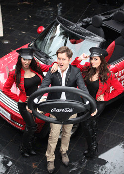 At the announcement of Coca-Cola HBC Ireland’s Christmas Road Safety initiative (from left): Ultimate Big Brother winner Brian Dowling launches the Coca-Cola Designated Driver Roadshow with models Georgia Salpa and Nadia Forde.