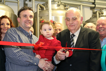 From left: Sinead and John O’Reilly with daughter Isabella and father John O’Reilly cut the ribbon at the launch of Donegal Brewing Company in Ballyshannon.