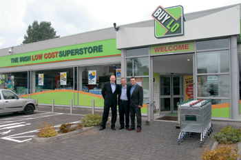 Jim Barry with Noel and Raymond McIntyre outside the new Buy Lo Store on the old Dublin Road, Mullingar