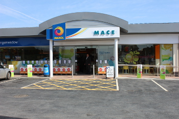 The exterior of Maxol Mace Kingsmeadow is vibrant and inviting, with excellent kerbside appeal