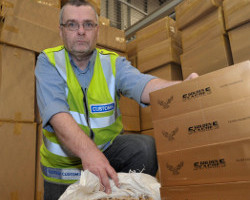 Custom officer Matthew Hudson with 38 million cigarettes with a retail value of EUR*14.7m seized by customs officers in Dublin Port last year. New proposed regulations by the EU are likely to grow the black market in cigarettes even further