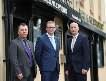 From left: Pubs of Ulster Chairman Mark Stewart with NI’s Finance Minister Simon Hamilton and Pubs of Ulster’s Chief Executive Colin Neill during the in-depth meeting in Ballynahinch yesterday.