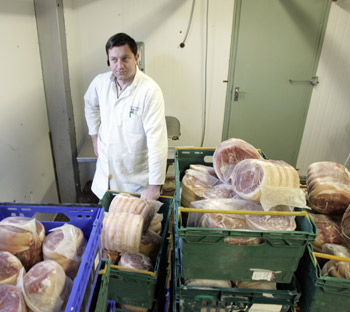 Peter Majewski loads up pork to be shipped out and destroyed from Groome’s Butchers O’Connell Square in Edenderry, Co. Offaly, where the Rosderra Factory is located due to the pork contamination there in 2008