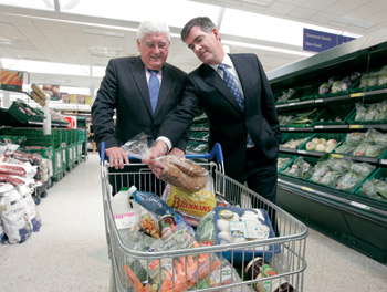 Supermarket sweep: The Fianna Fail Minister for Enterprise, Trade and Innovation, Batt O'Keeffe, and Tony Keohane, Tesco Ireland CEO, announced Tesco’s E113 million investment plans last year – but no mention was made of the possible job displacement caused by the supermarket’s 748 anticipated new jobs