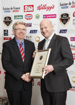 John McDonald, ShelfLife, on behalf of award sponsor Gala, presents the award for Supplier of the Year 2010 to David McEnroe of Cuisine de France