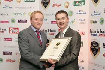 Mark Morgan, account manager, ShelfLife.ie, presents the award for Best Retail Technology Application 2011 to Seamus McHugh, marketing manager, CBE
