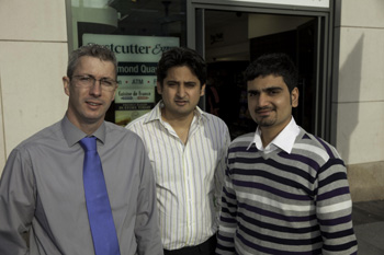 The Barry Group’s Damien Johnston, with retailers Azhar Mahmood and Haroon Nawab