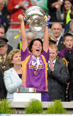 President Mary McAleese and Gary Desmond, CEO, Gala Retail Services with winning Wexford team captain Una Lacey