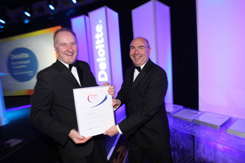 Jim Barry, MD of The Barry Group, accepting his award from Ger O’Mahoney, regional partner in charge, Deloitte and President of the Cork Chamber of Commerce