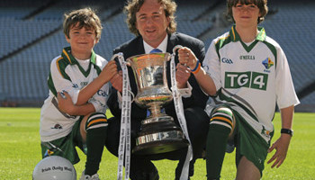 Paul Henderson, managing director of Associated Newspapers with two young GAA fans