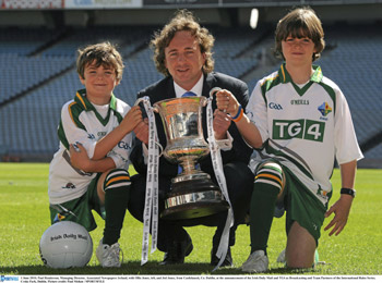Paul Henderson, managing director of Associated Newspapers with two young GAA fans