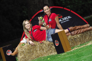 Models Sarah Morrissey and Baiba Gaile chilling out on bales of hay in St Stephen’s Green for the launch of Bicardi’s B-Live spectacular at Electric Picnic