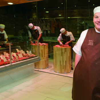 Pat Whelan at the front of his butchers store within Avoca in Monkstown