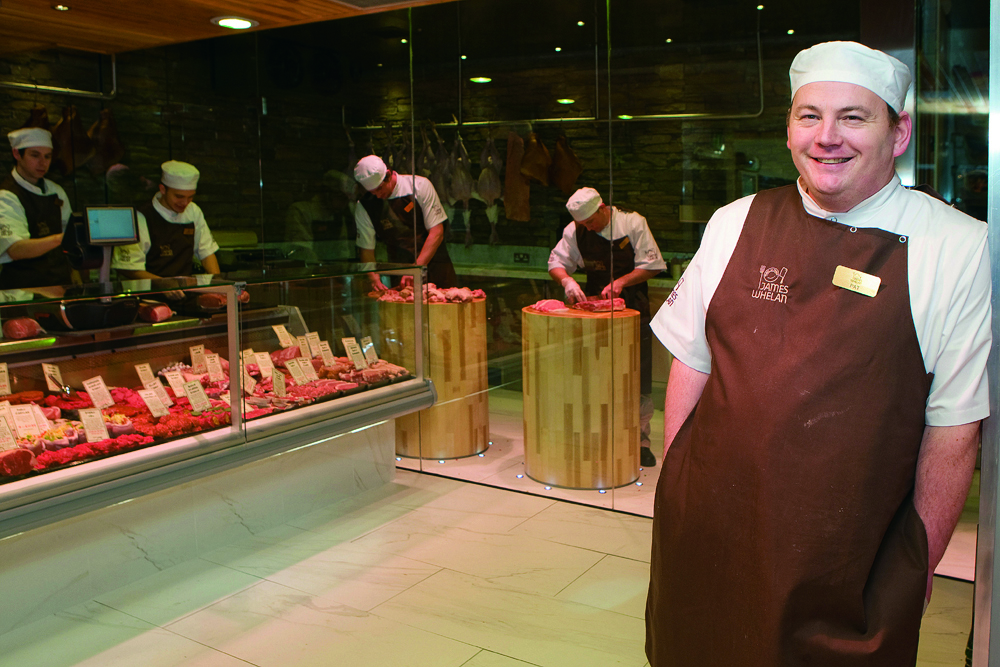 Pat Whelan at the front of his butchers store within Avoca in Monkstown