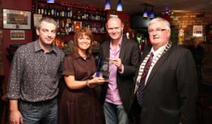 From left: Padraig and Geraldine Killoran, proprietors of Kelly’s Bar in Strandhill, Co Sligo, who won the From left: Padraig and Geraldine Killoran, proprietors of Kelly’s Bar in Strandhill, Co Sligo, who won the 2010 Best Local award, receiving their award from NewsTalk’s Sean Moncrief with VFI President Gerry Mellett in their bar recently.
