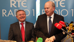 Labour Party Minister for Public Expenditure and Reform Brendan Howlin with Fine Gael Minister for Finance Michael Noonan speaking to the media after conducting the annual radio interview on the Budget on Radio 1 in RTÉ studios in Dublin on budget day