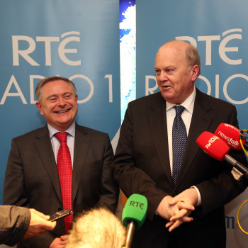 Labour Party Minister for Public Expenditure and Reform Brendan Howlin with Fine Gael Minister for Finance Michael Noonan speaking to the media after conducting the annual radio interview on the Budget on Radio 1 in RTÉ studios in Dublin on budget day