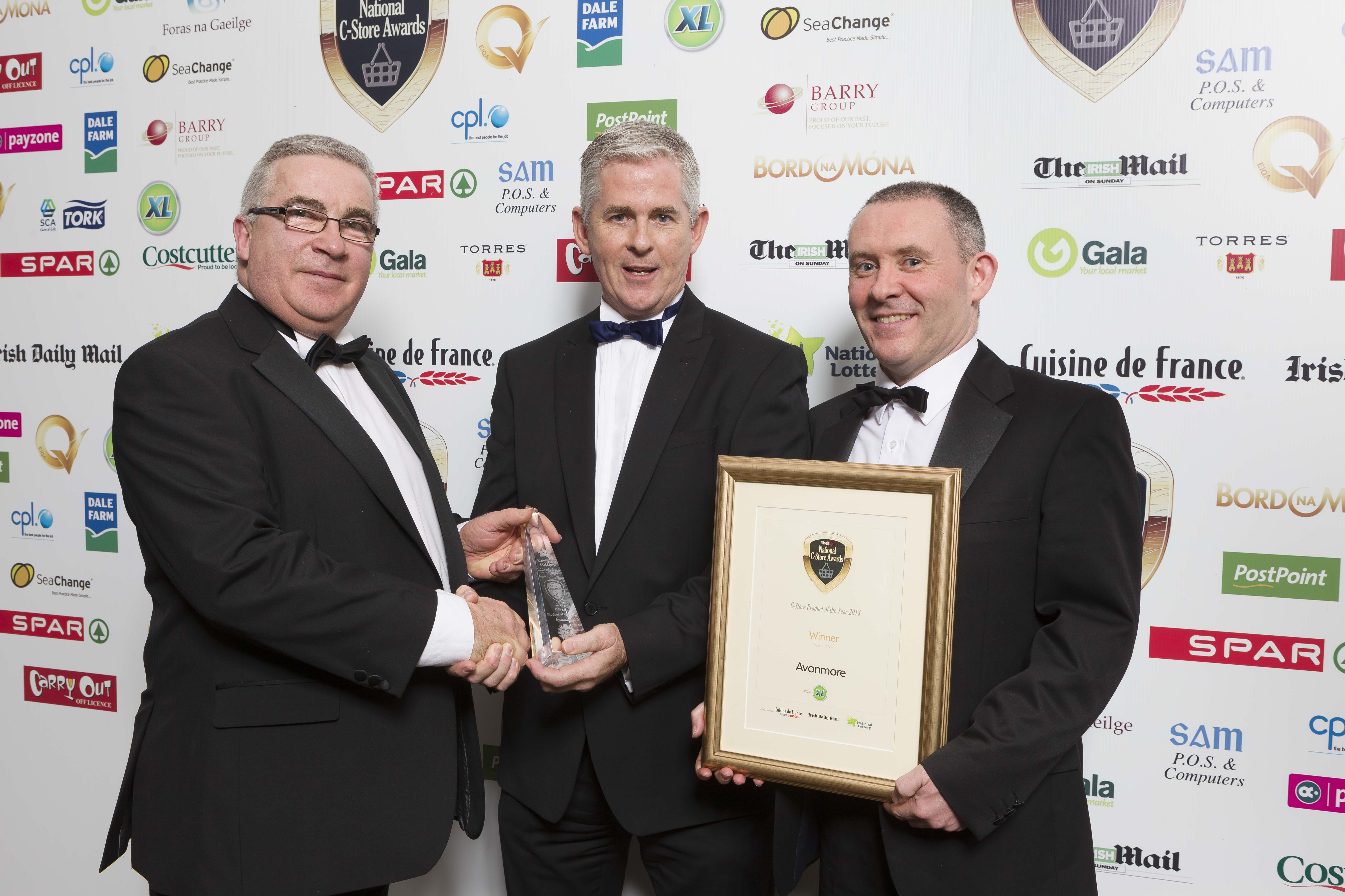 Colm Fitzsimons, national XL business development manager, presents the award for C-Store Product of the Year to Adrian Tiernan and Declan Fennelly of Avonmore