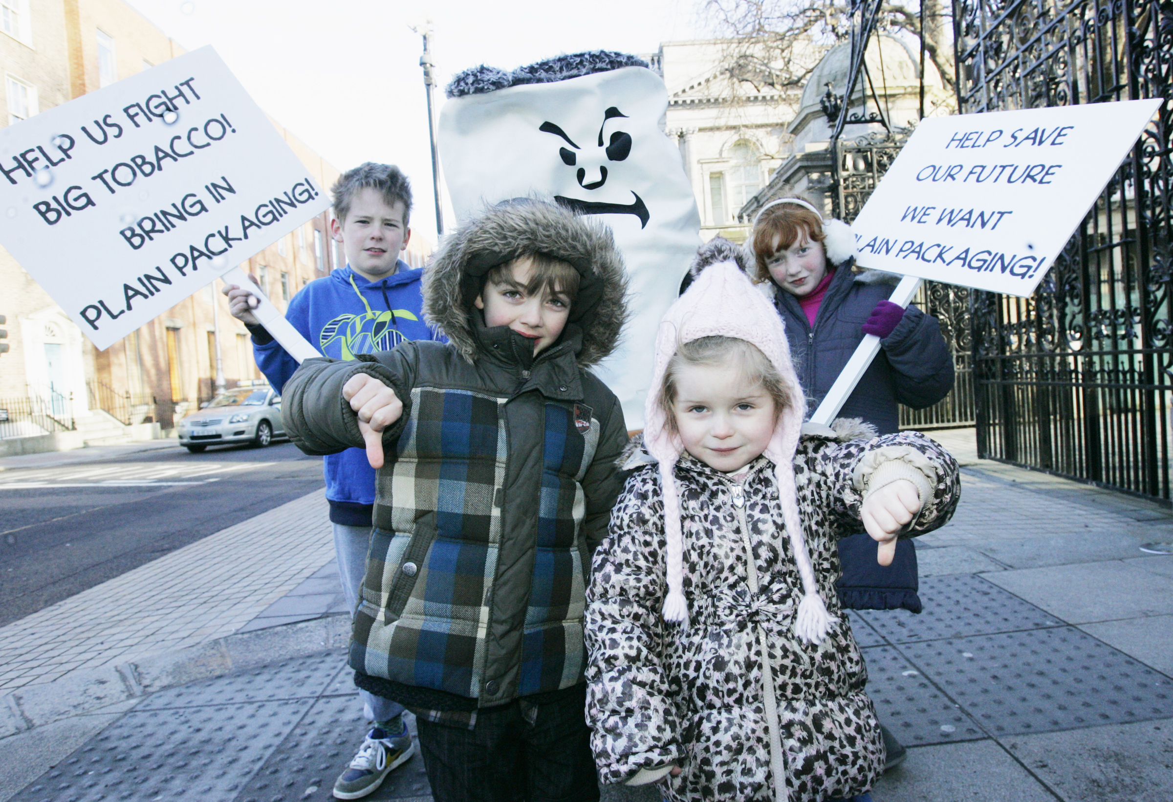 The Irish Cancer Society enlists the help of some children to hammer home its message. Joining the protest outside Leinster House are, from left, Reuben Ring (10), Cathal Gray (6), Charlotte Stafford (3) and Aoife Gray (8)
