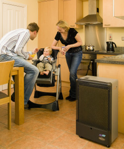 A family enjoying some quality time in a kitchen warmed by a Flogas Superser Catalytic heater