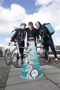 Deliveroo rider Lasairiona Power, Deliveroo general manager of Ireland, Oliver Dewhurst and Daniel Cegliese 