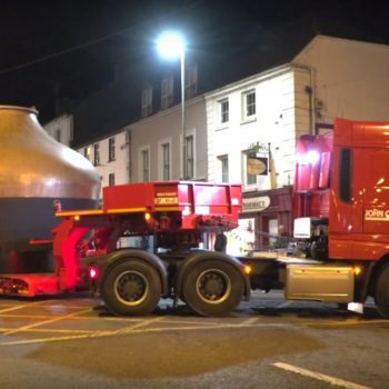 Enormous articulated lorries transport three brand new copper pot stills to Midleton's historic distillery