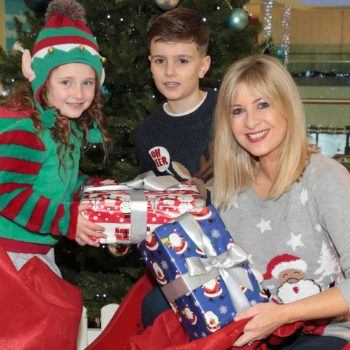 Tv presenter Laura Woods with the help of Finnley McKenna (age 7) and Brooke Walton (age 5) launches Tesco Ireland's annual Christmas Appeal