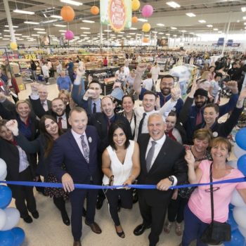 Executives, staff and customers gathered to help open the new store, while Lucy Kennedy was on hand to cut the ribbon
