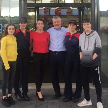 Proud retailer Ken Foley poses with his family and team members outside the new Donegal Supermacs Service Station