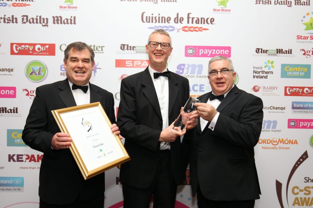 Colm Fitzsimons, national development manager, XL, presents the award for C-Store Product of the Year to Frank Tolan (L) and Stephen Stewart of Coca-Cola