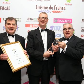 Colm Fitzsimons, national development manager, XL, presents the award for C-Store Product of the Year to Frank Tolan (L) and Stephen Stewart of Coca-Cola