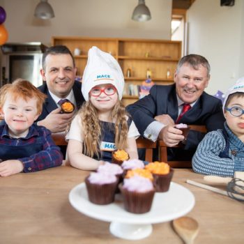 Daniel O’Connell, MACE Sales Director with Gary Owens, CEO of DSI, with Blaise Coates, 6, Sorcha Maguire, 7, and Rafael Siewierski, 7