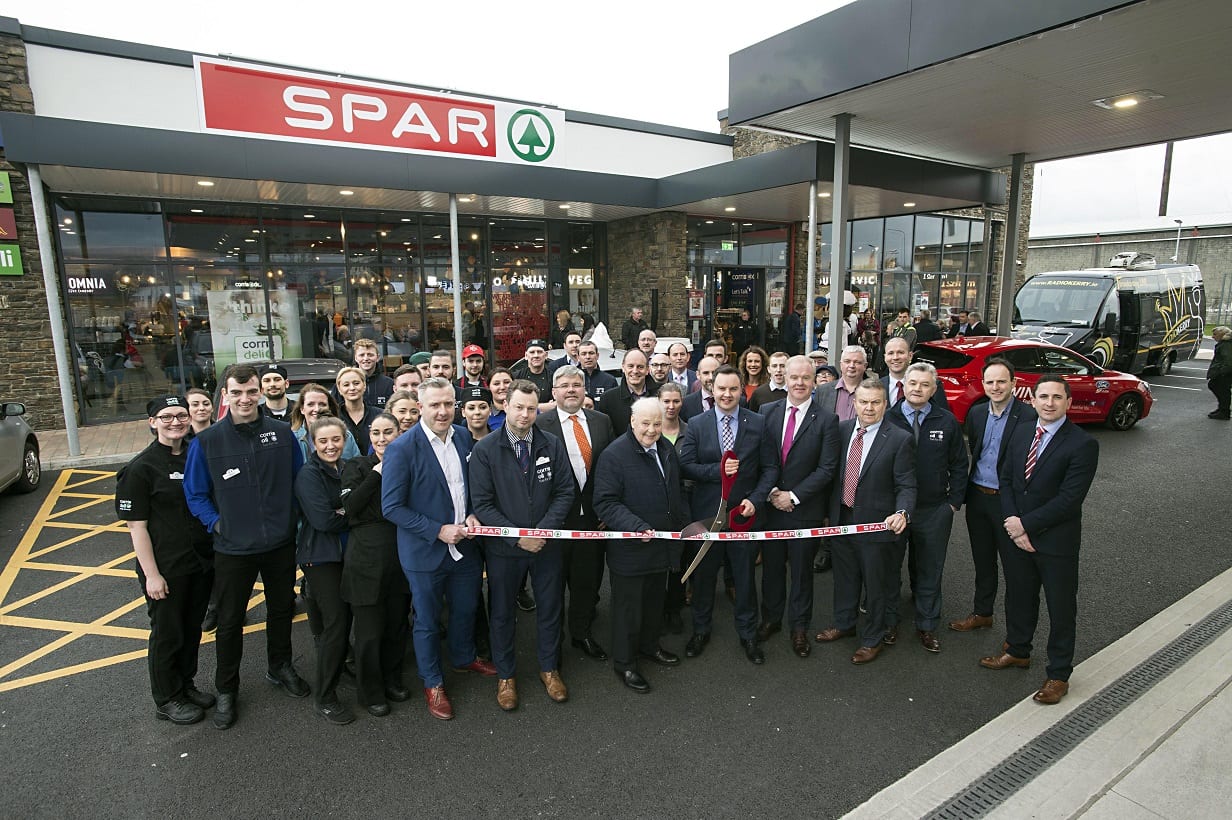 Eugene Dalton, senior and founder of Corrib Oil cuts the tape at the opening of SPAR Corrib Oil in Tralee