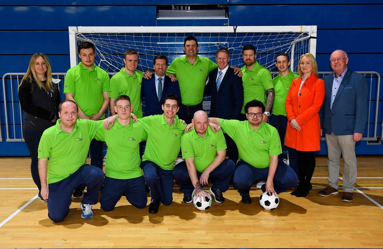 Niall Quinn with Matt English, CEO, Special Olympics Ireland, and Gary Desmond, CEO, Gala Retail, with Special Olympics Team Ireland soccer players