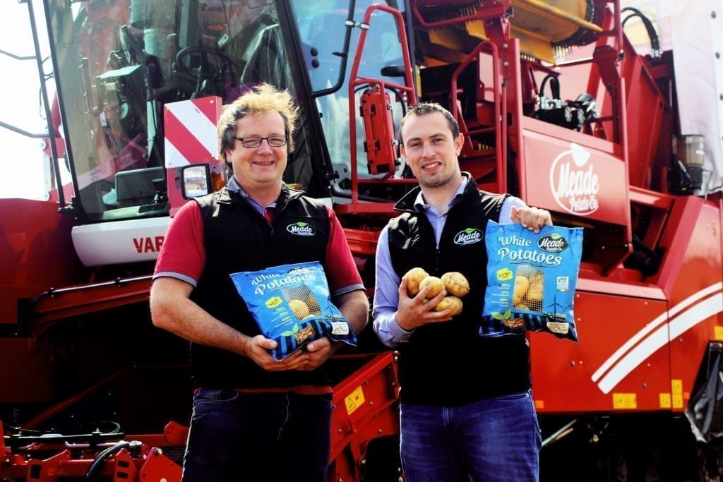  Farm manager Conor O’Malley and commercial director Philip Meade Jr. with the Meade 2kg White Potatoes packed in a 100% compostable paper pillow pack bag
